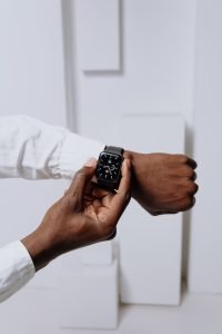 Close-up of a smartwatch on a person's wrist, highlighting modern technology with a minimalist aesthetic.